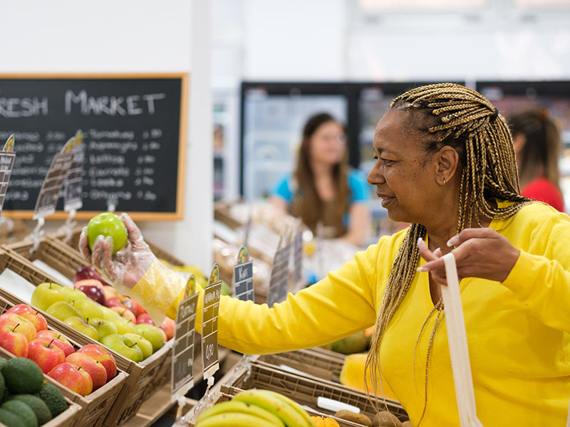 Woman shopping for fruits and vegetables